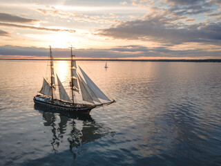 Tall Ship Sailing at Sunset