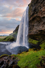 Majestic Seljalandsfoss Waterfall at Sunset in Iceland with Lush Green Landscape