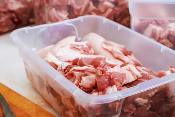 Pork meat is prepared for marinating before being grilled BBQ