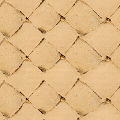 Seamless 4k photo texture of damaged and mesh patterned cardboard paper surface.