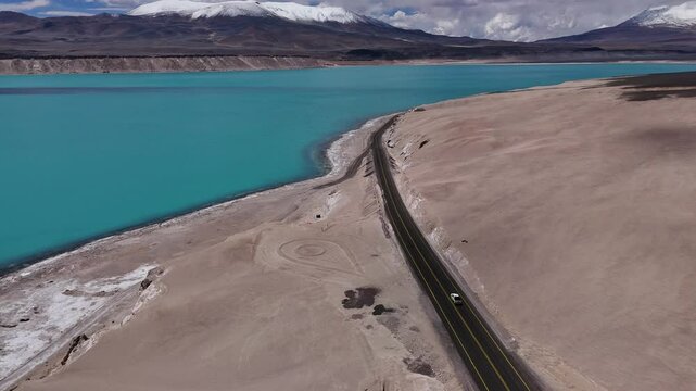 Stunning aerial footage of Laguna Verde South America's natural splendor lagoons vibrant colors. Aerial shot of Laguna Verde presenting majestic landscape of South America tranquil environment.
