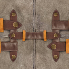 Seamless 4k armor photo texture photo of gray colored suede leather material sewn together with leather strap ornament.