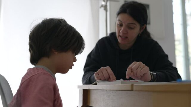 Parent and child engaged in an intense study session, highlighting the challenges and concentration required for effective learning in a home environment
