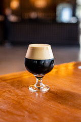 glass of beer on wooden table