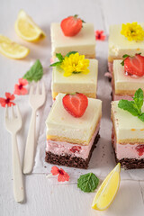 Delicious and creamy strawberry sponge cake with jelly and fruits.