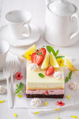 Sweet and tasty strawberry sponge cake with jelly and fruits.