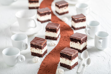 Homemade chocolate cream cake with dark biscuit and cream.