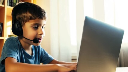 Teenage boy kid wearing a headset using laptop computer - Powered by Adobe