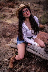 Obraz premium cowgirl lay back boot up, Happy cowgirl riding trunk