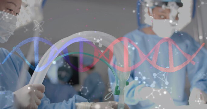 Performing procedure, medical professionals in surgical attire with DNA strand overlay