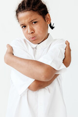 Excited young boy in white shirt reaching out with trendy style and enthusiasm