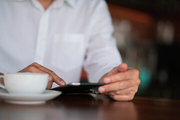 Portrait of a handsome young manworking with laptop in coffee shop cafe smile and happy face.