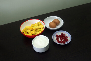 Assortment of Fresh Cooking Ingredients Including Egg, Onion, Green Chili, Coriander Leaves, Cucumber, Tomato, Cabbage, Potato, Bread, Noodles, Sugar, Jackfruit, Carrot, Garlic, Ginger, Lemon