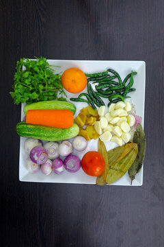 Assortment of Fresh Cooking Ingredients Including Egg, Onion, Green Chili, Coriander Leaves, Cucumber, Tomato, Cabbage, Potato, Bread, Noodles, Sugar, Jackfruit, Carrot, Garlic, Ginger, Lemon