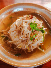Soto is traditional Indonesian soup mainly composed of broth, meat or chicken, and vegetables.