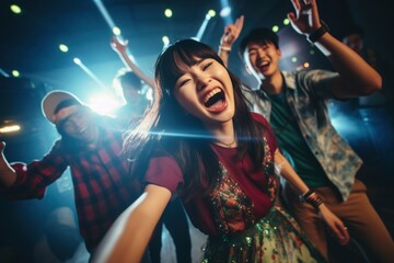 Asian friends dancing having fun party celebration nightlife.