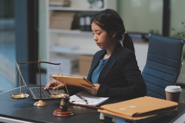 female business woman lawyers working at the law firms. Judge gavel with scales of justice. Legal law, lawyer, documents, advice and justice concept.