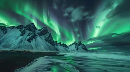 Amazing view of green aurora borealis shining in night sky over snowy mountain ridge with black sand stockness beach and vestrahorn mountain in background in iceland. 