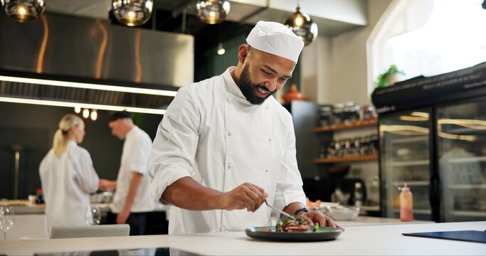 Man, chef and happy with food in kitchen at restaurant for fine dining, meal and creativity. Male employee, professional and cooker with smile for culinarily, hospitality and catering service