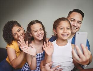 Cellphone, video call and family waving in home for online communication, contact or networking. Connectivity, phone and children with parents for greeting on virtual mobile conversation at house.