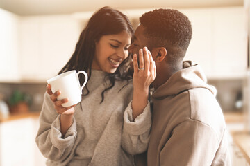 Couple Enjoying Coffee and Intimacy in Kitchen