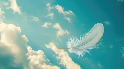 Single white feather descending in the sky