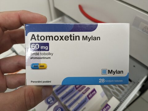 Prague, Czech Republic - July 10 2024: ATOMOXETIN MYLAN box of medication with ATOMOXETINE active substance by MYLAN, used for treatment of ADHD.