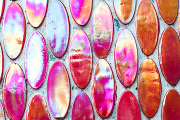 Texture of mother-of-pearl mosaic round tiles, close-up