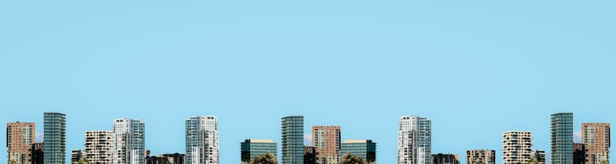 Fototapeta premium Top view photography of the city and the buildings city scape agint clean blue sky background.