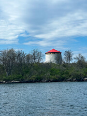 Historic Martello Tower with Red Roof on Lake Ontario Shore, Kingston, Ontario, Canada
