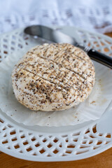 French fresh white soft goat cheeses with topping made with black pepper