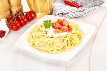 Pasta spaghetti with salmon and stracciatella