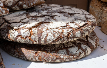 Artisanal organic fresh baked dark brown rye bread, bio grains bread