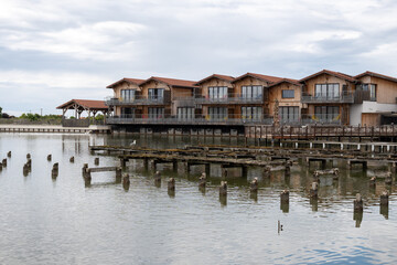 Travelling in France, old wooden huts and oysters farms in Gujan-Mestras village, cultivation and sale of fresh oysters seashells, Arcachon bay, Atlantic ocean, France, tourists destination