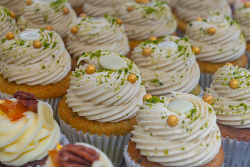 Sweet dessert fresh baked meringue cup cakes in bakery