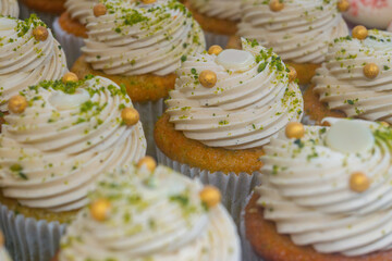 Sweet dessert fresh baked meringue cup cakes in bakery