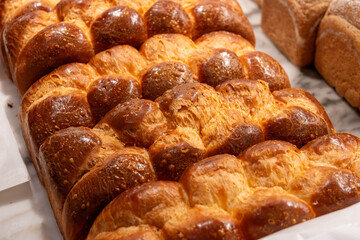 Traditional Jewish bread challah braided brioche bread in bakery