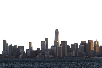 Fototapeta premium A skyline view of San Francisco illuminated by the sunset, on the background of a clear sky