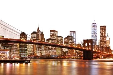 A vibrant night view of Manhattan skyline with the Brooklyn Bridge, illuminated buildings, and reflections on water