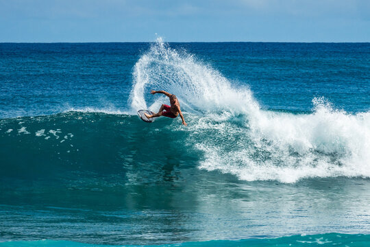 Man surfing in the ocean, North shore, Oahu island, Hawaii