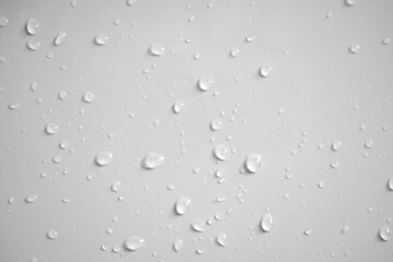 Water drops on white wall background texture