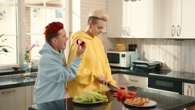 A touching lesbian proposal in a warm kitchen radiates love and happiness. This intimate moment symbolizes commitment and samesex love, showcasing a beautiful celebration of partnership and joy