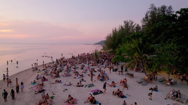 people chilling and playing drumms on a zen beach, Koh-Phangan, sunset,party