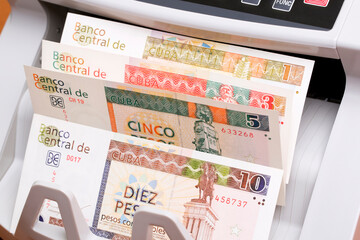 Cuban Convertible Pesos in the counting machine