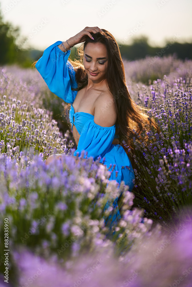 Wall mural woman in a lavender field