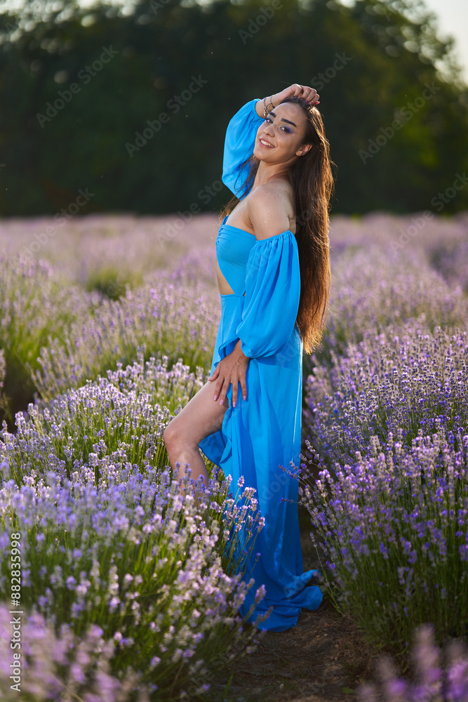 Wall mural Woman in a lavender field