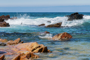 rocks and crashing waves on the beach