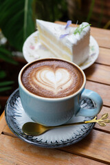 hot mocha  on the table with coconut  cake