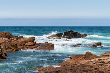 rocks and crashing waves on the beach