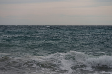 Background of stormy mediterranean sea with horizon
